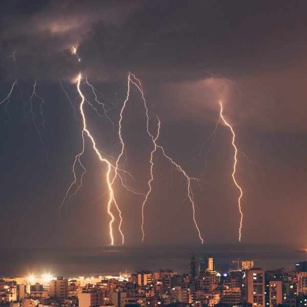 Beautiful lightning over night city, amazing cityscape with many bright zippers over it. Beirut, Lebanon